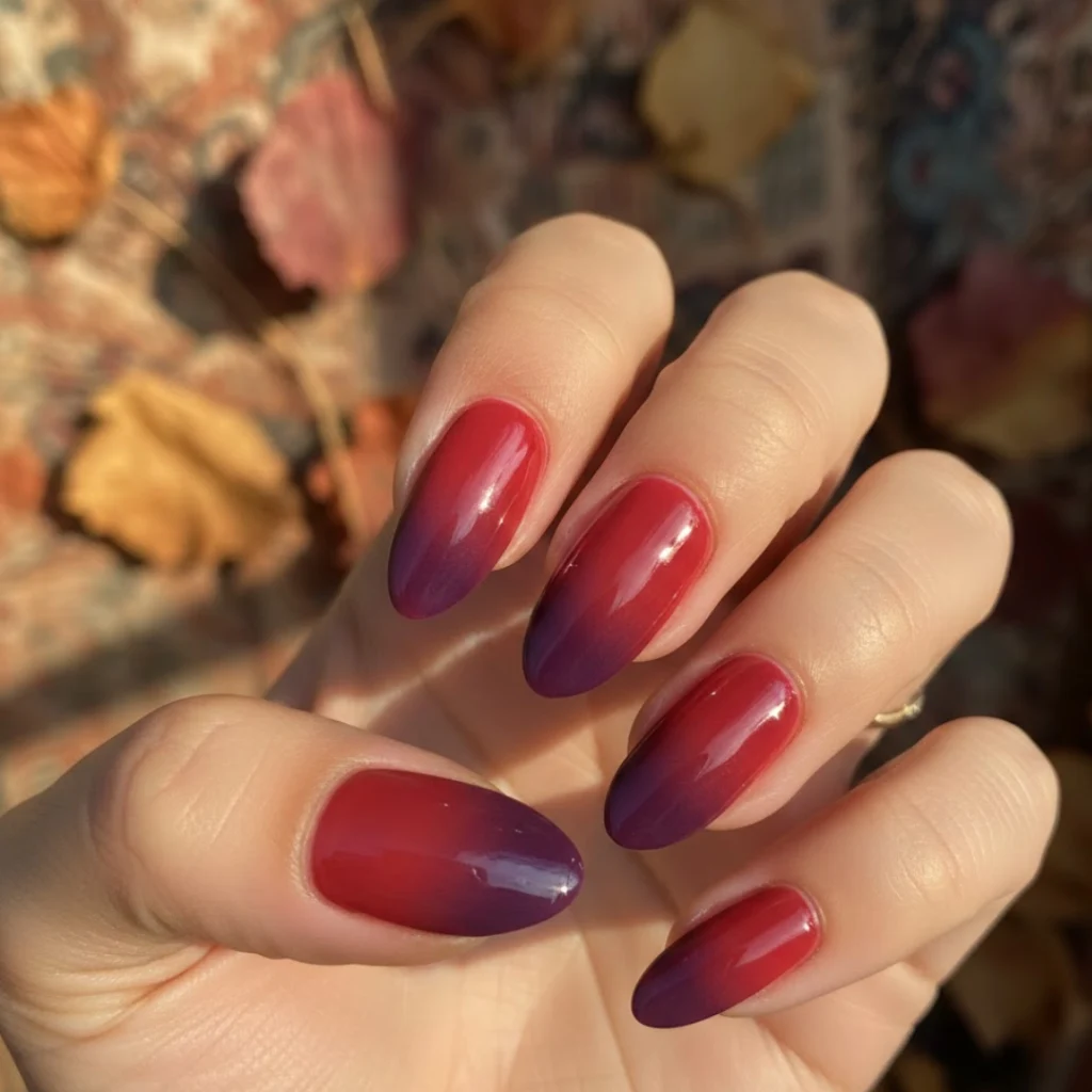 Berry ombre almond nails with a smooth raspberry-to-plum gradient.