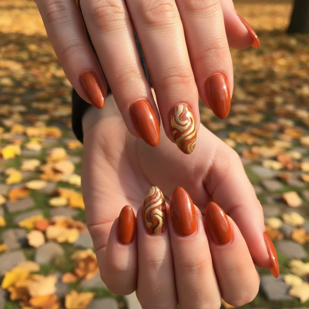 Burnt orange almond nails with a glossy fall-inspired finish.